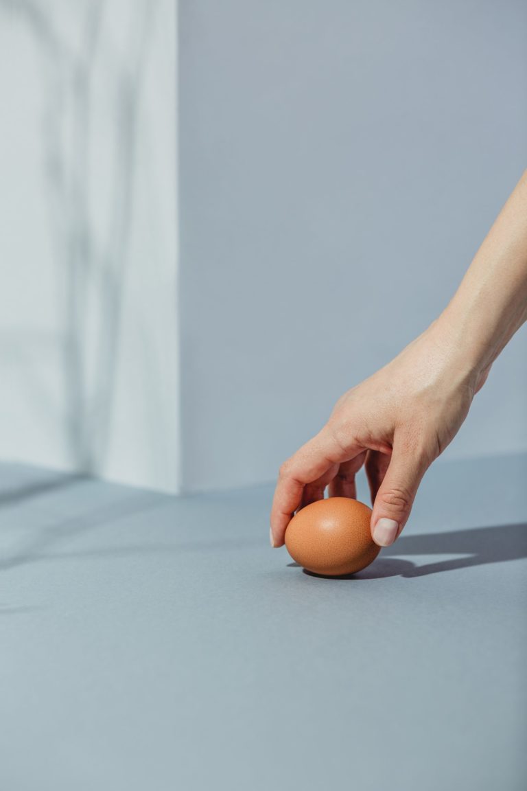 Hand is taking egg